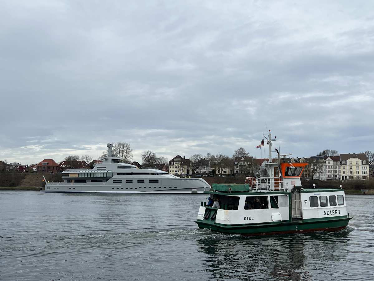 Adler I canal ferry and megayacht 1601 in the Kiel Canal