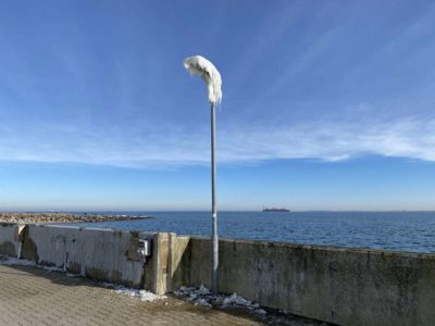 Lantern with ice harbor of Strande Baltic Sea